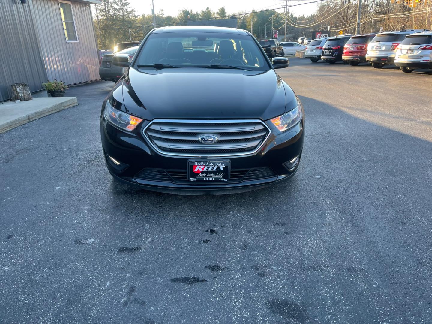 2013 Black /Black Ford Taurus SEL FWD (1FAHP2E85DG) with an 3.5L V6 DOHC 24V engine, 6-Speed Automatic transmission, located at 547 E. Main St., Orwell, OH, 44076, (440) 437-5893, 41.535435, -80.847855 - Photo#1